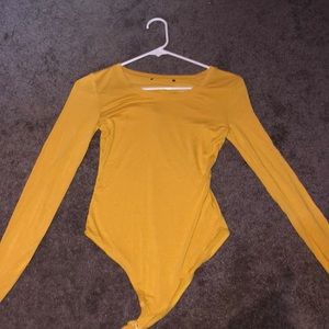yellow body suit